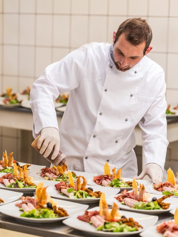 Chef decorating appetizer plate