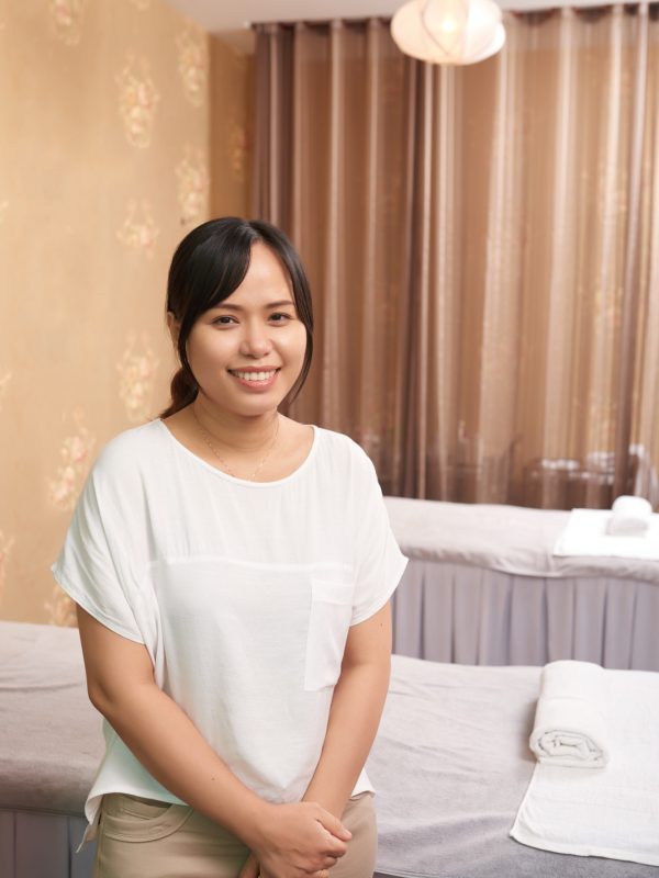 Massage therapist working in spa salon